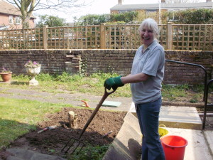 Volunteer Gardener happy at work!